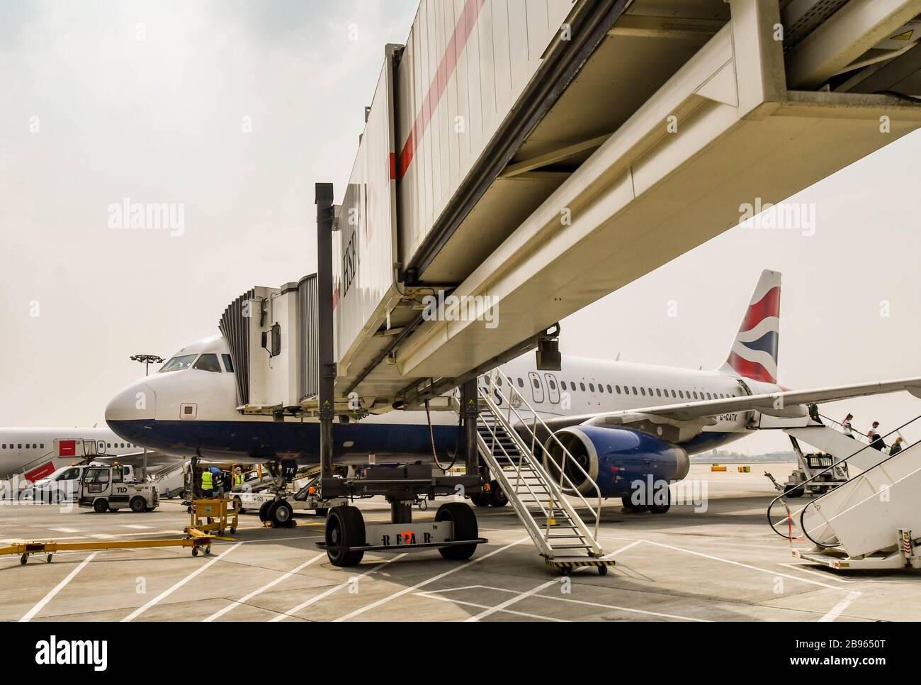 LONDON GATWICK AIRPORT, ENGLAND - APRIL 2019: British Airways Airbus jet attached to a jet bridge at London Gatwick Airport Stock Photo