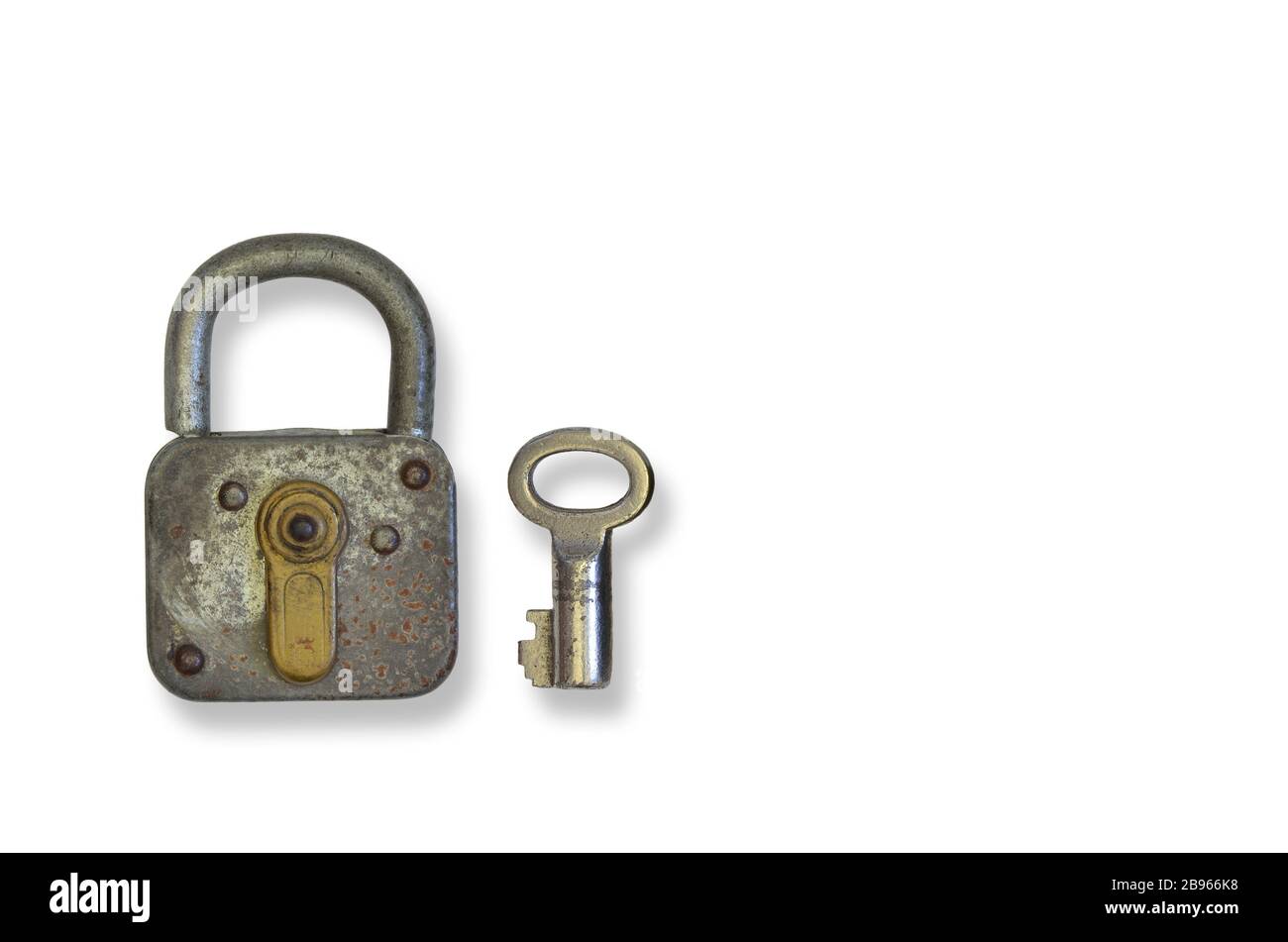 rusty old padlock with key, close up, isolated on white background Stock Photo
