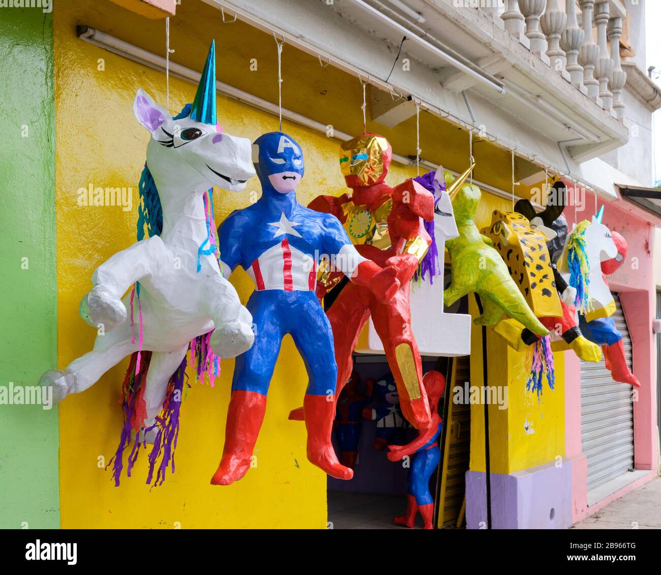 Pinata store in Oaxaca, with hanging display featuring super heros and
