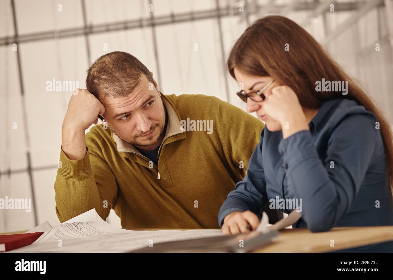 Two young architects working on a project Stock Photo
