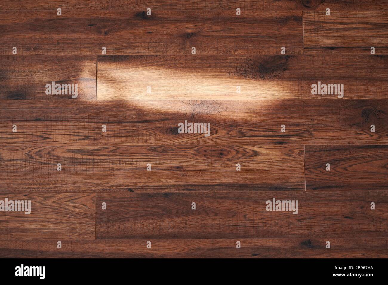 Light spot on wooden floor background. Sun ray on wood surface Stock