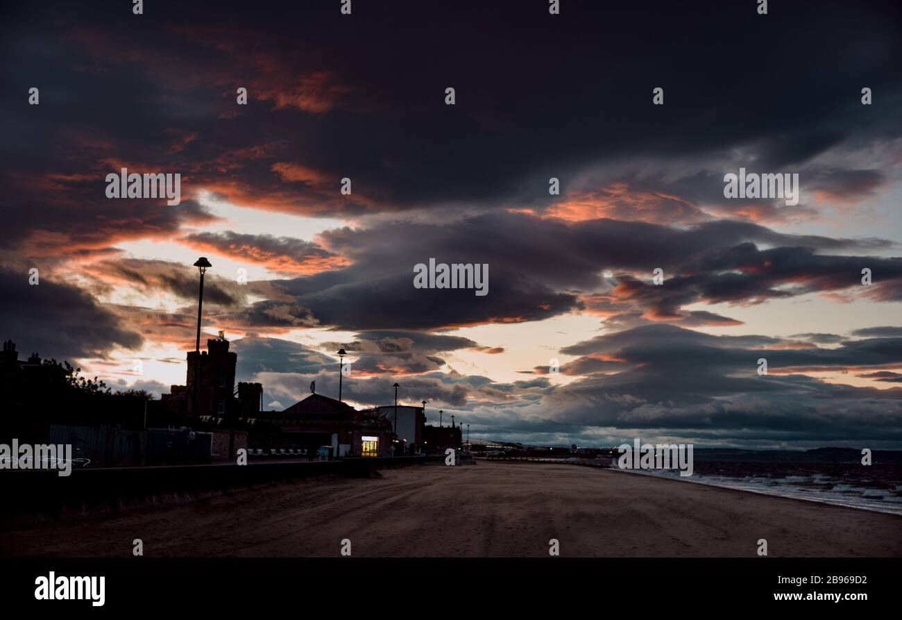 Dramatic and colorful sunset at Portobello Beach in Edinburgh, Scotland. Stock Photo