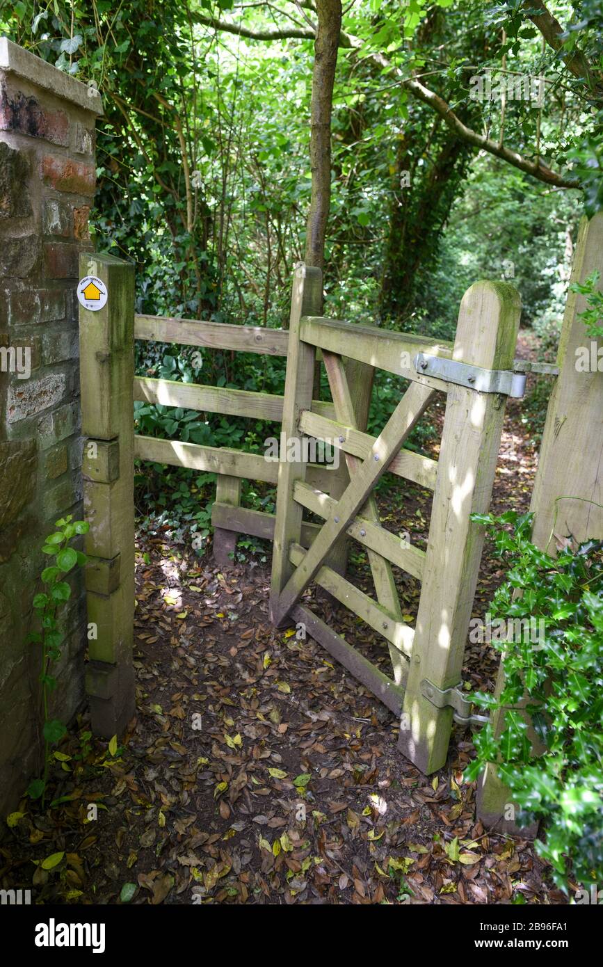Stile on the UK's Shropshire way footpath with signs indicating the direction and asking for dog control. Stock Photo
