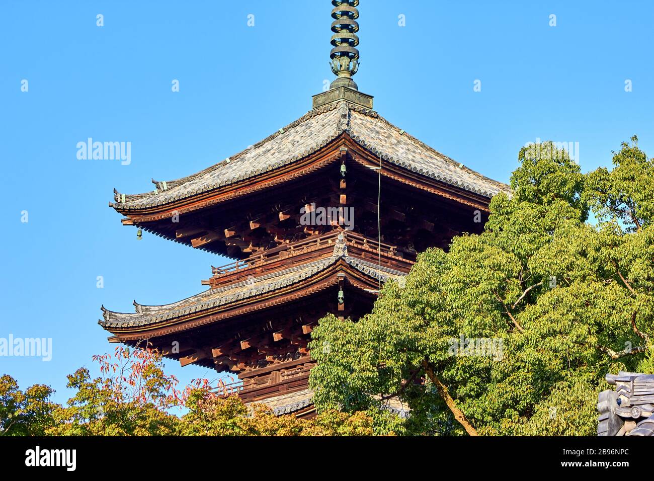 Huge pagoda surrounded by trees Stock Photo