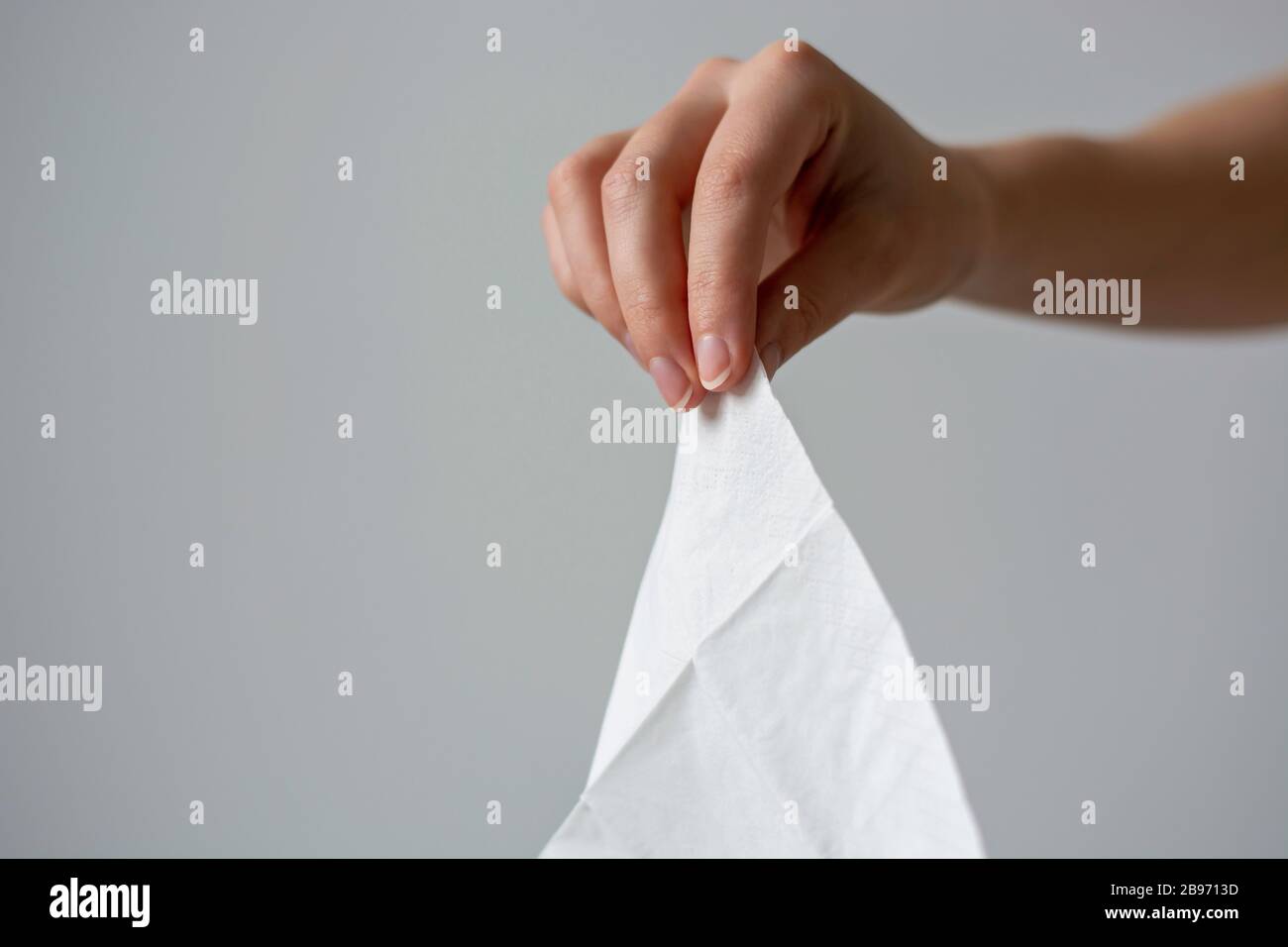 A female hand holding a white clean disposable tissue paper handkerchief  Stock Photo - Alamy