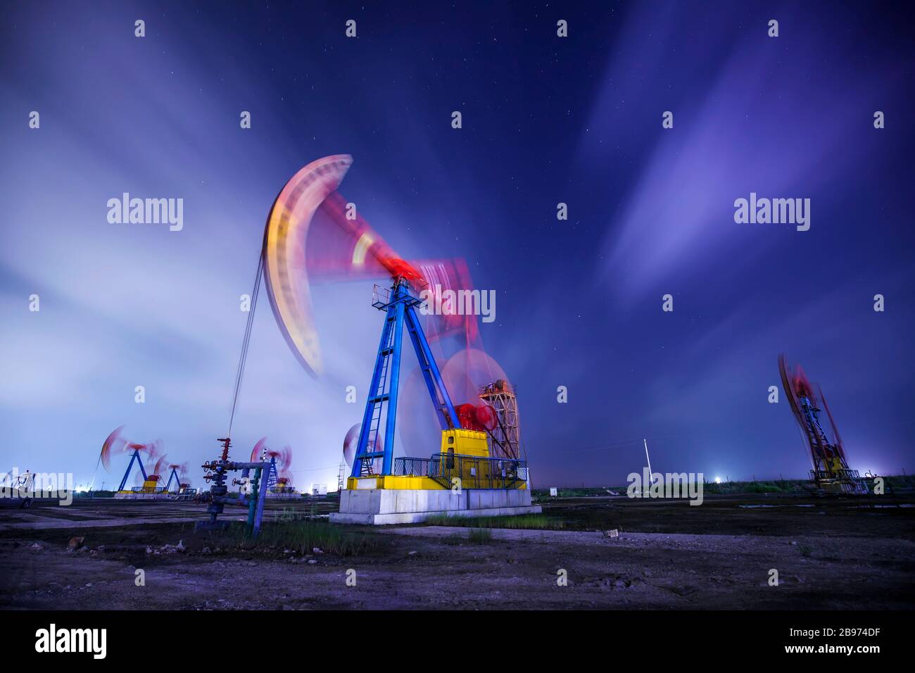 The oil pump and flow cloud in the evening Stock Photo Alamy