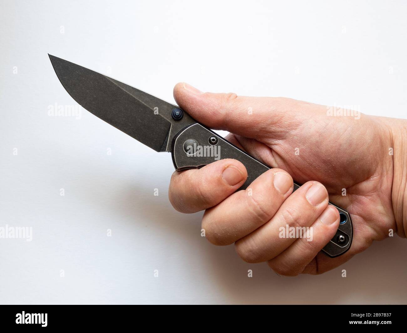 Closeup hand holding knife sharp hires stock photography and images