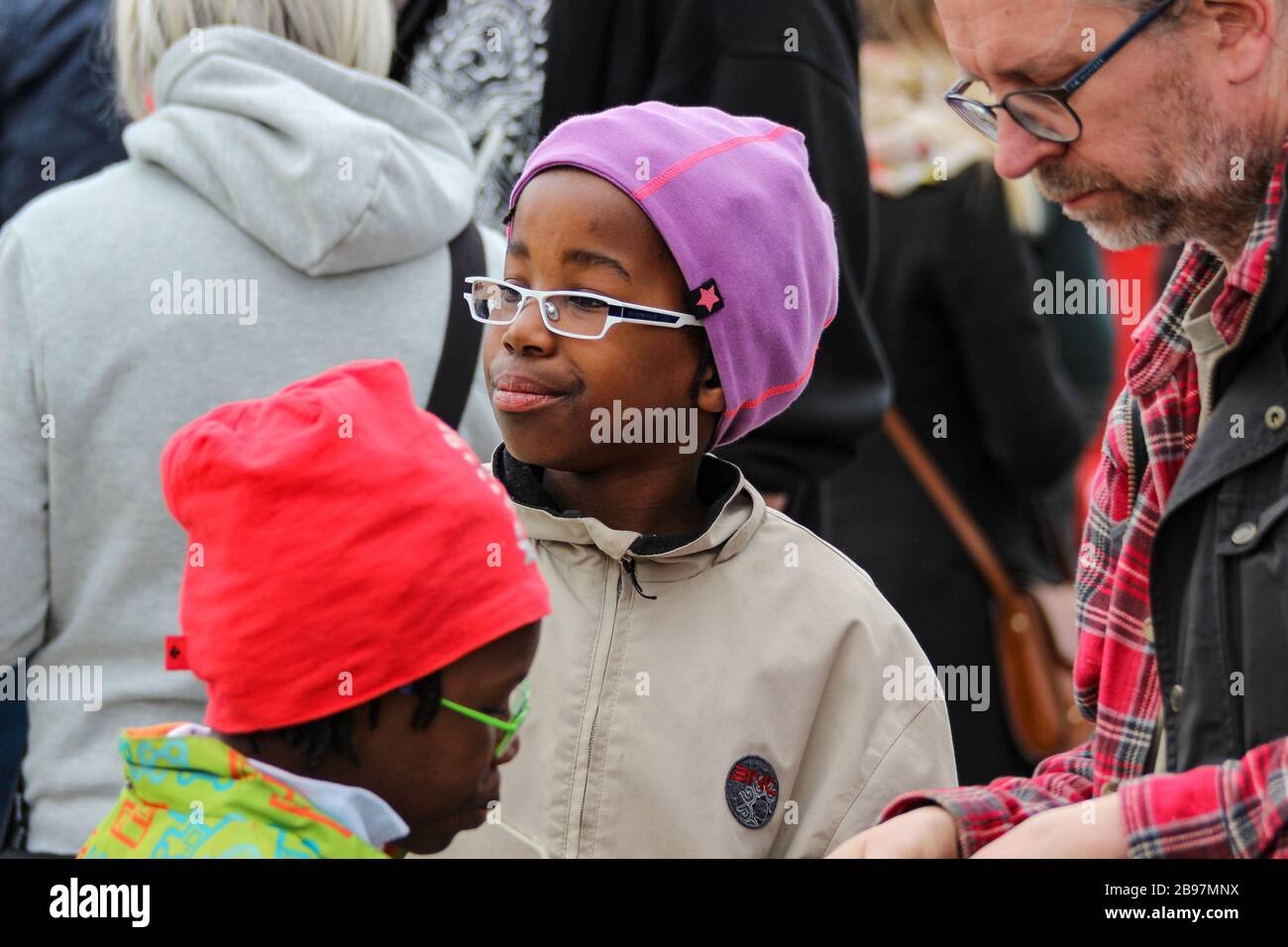 Children with eyeglasses and beanies Stock Photo