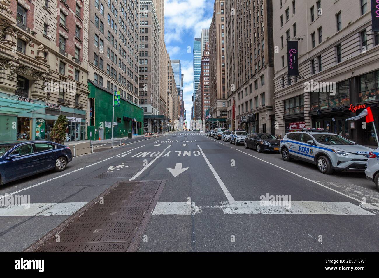 Few automobiles travel on the empty streets in New York City because of COVID-19, Coronavirus. Stock Photo