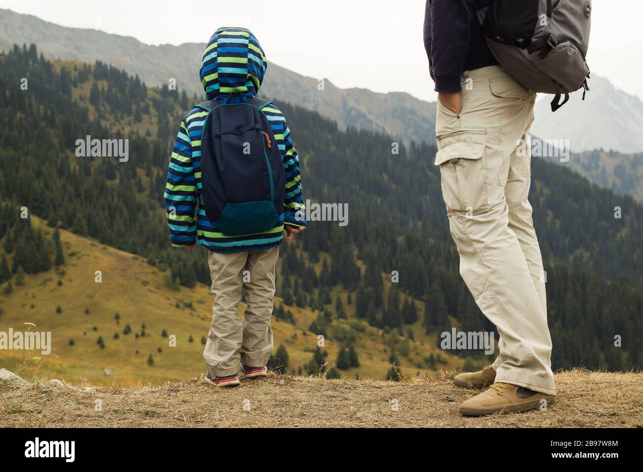 Father and son tracking together in mountians Stock Photo - Alamy