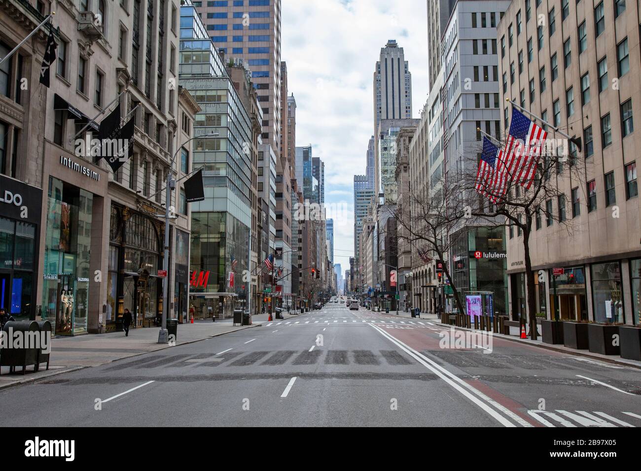 Few automobiles travel on the empty streets in New York City because of COVID-19, Coronavirus. Stock Photo