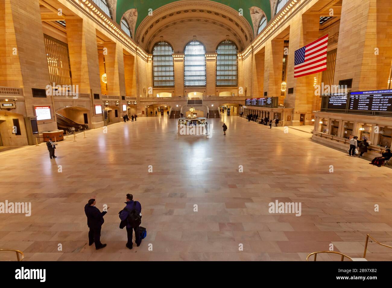 Very few passengers in Grand Central Station in New York City because of COVID-19, Coronavirus. Stock Photo