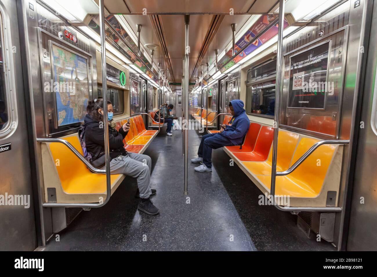 Very few passengers riding the subway in New York City because of COVID-19, Coronavirus. Stock Photo
