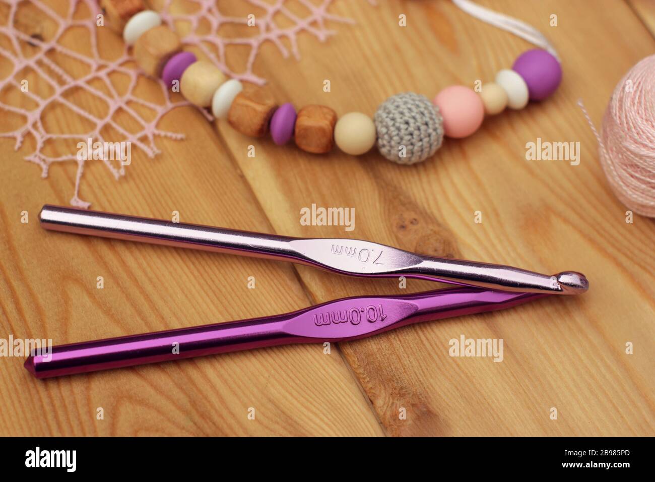 crocheted baby pacifier holder. Yarn hooks Stock Photo Alamy