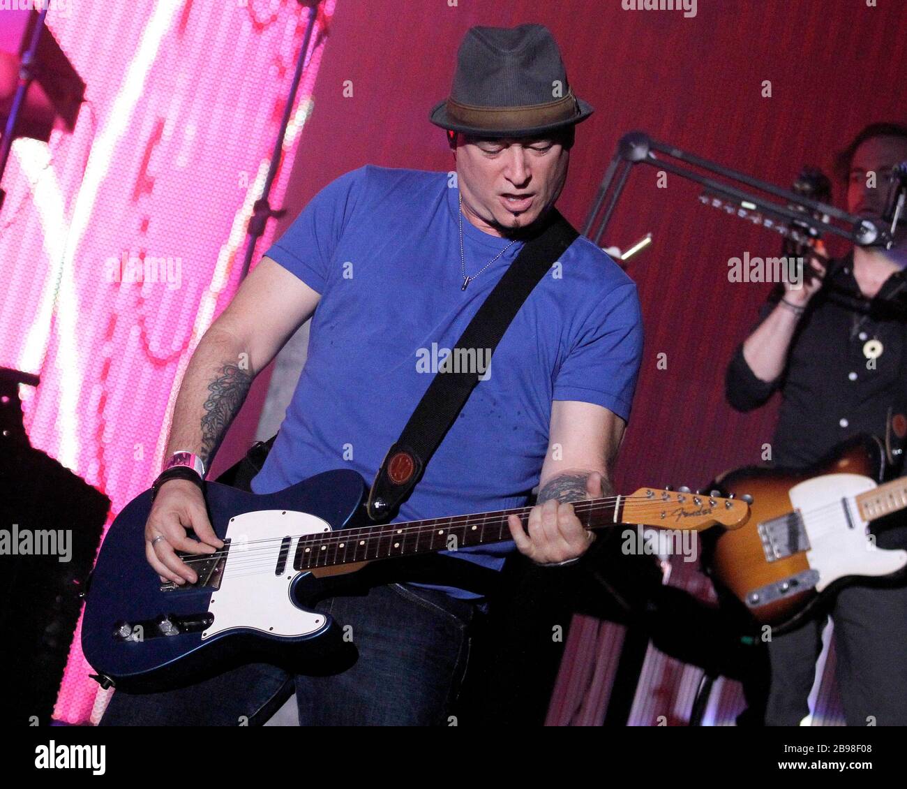 Train guitarist Jimmy Stafford performs with the rest of the band at
