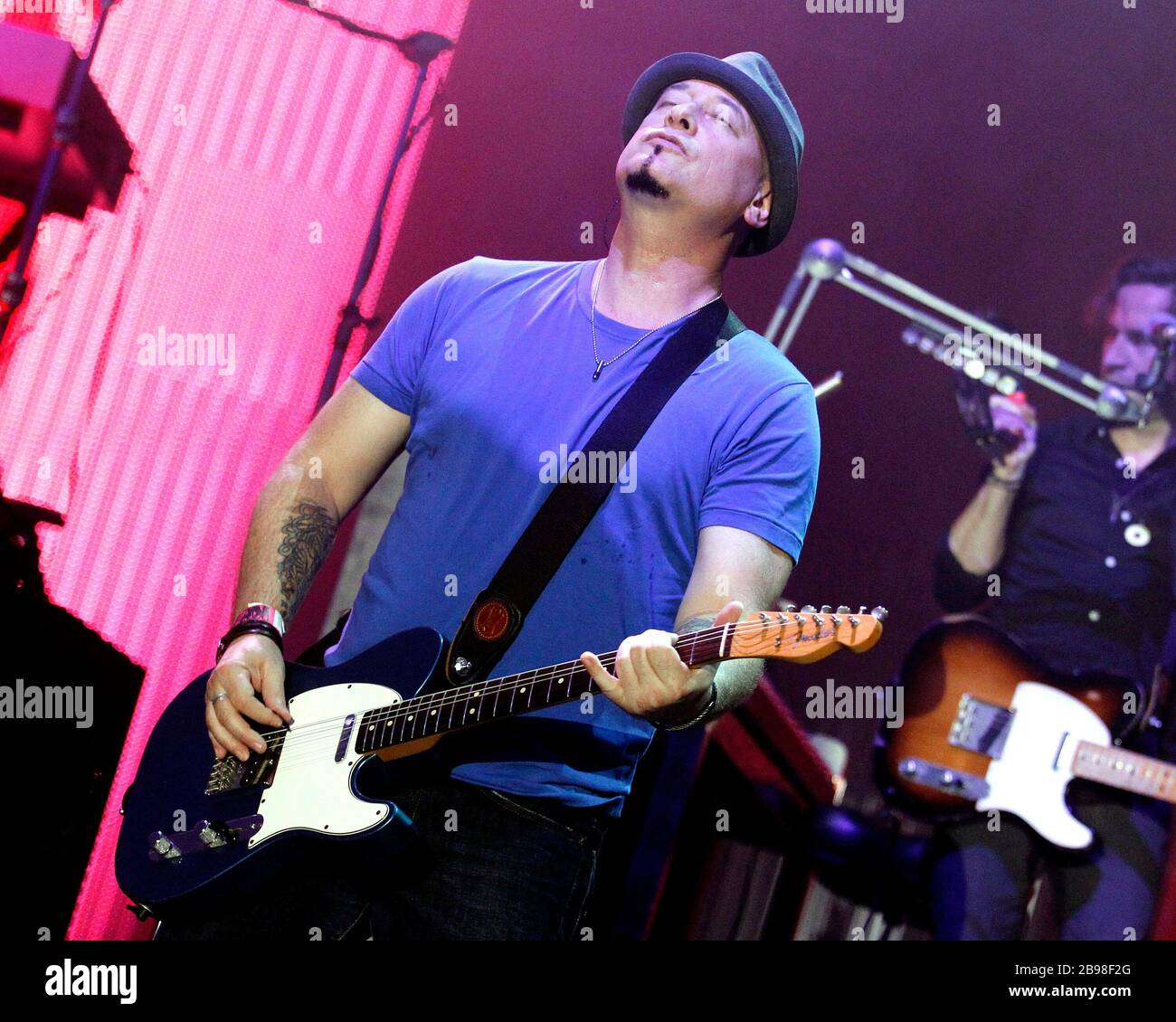 Train guitarist Jimmy Stafford performs with the rest of the band at