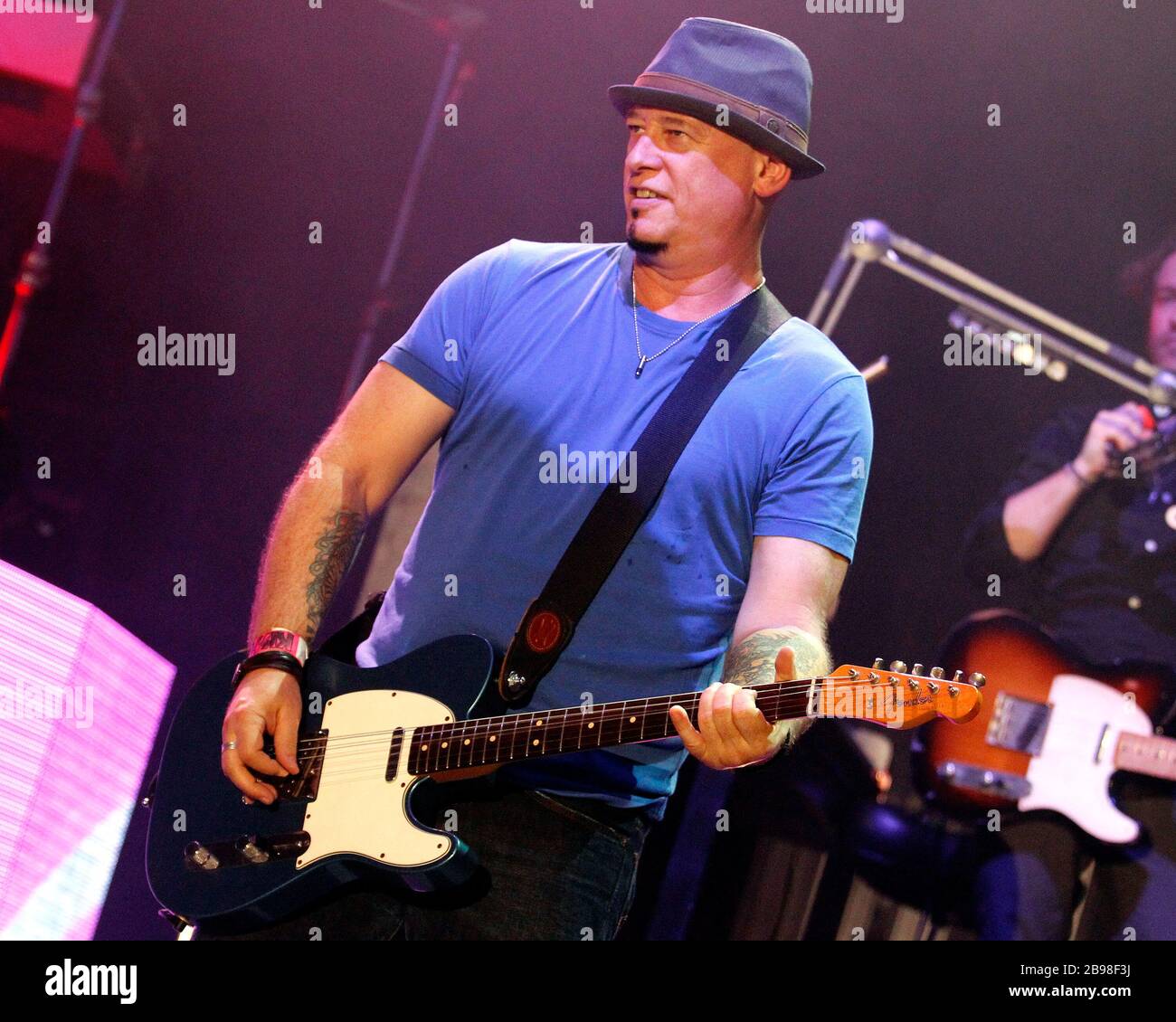 Train guitarist Jimmy Stafford performs with the rest of the band at