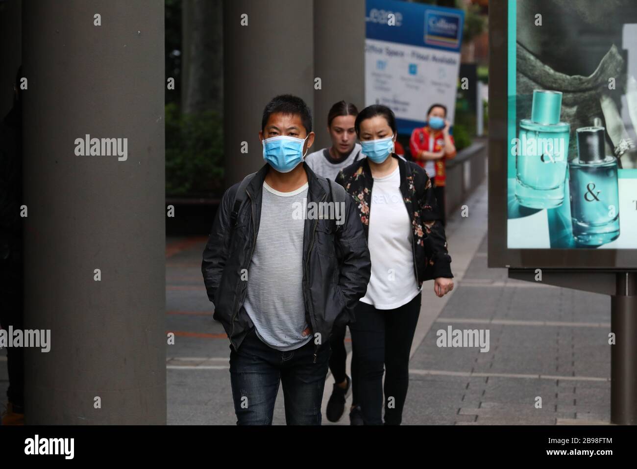 SYDNEY, AUSTRALIA, 24 Mar 2020, People line up to visit a Centrelink service centre in Burwood, Sydney, after job losses from coronavirus have prompted a surge in demand for unemployment payments. Credit: Sebastian Reategui/Alamy Live News Stock Photo