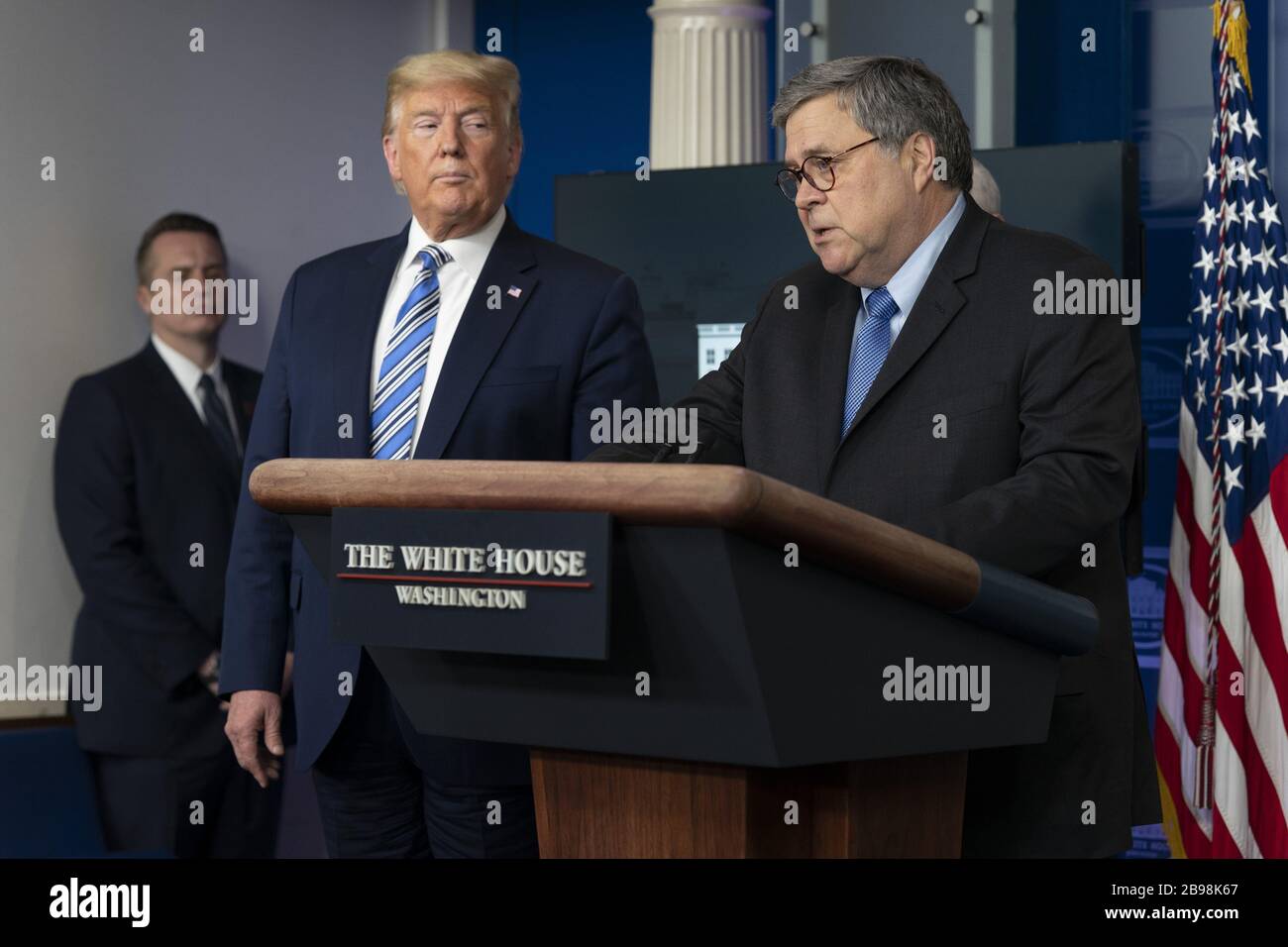Washington, United States. 23rd Mar, 2020. President Donald J. Trump listens as the United States Attorney General William P. Barr participates in a news briefing by members of the Coronavirus Task Force at the White House in Washington, DC on March 23, 2020. Photo by Chris Kleponis/UPI Credit: UPI/Alamy Live News Stock Photo