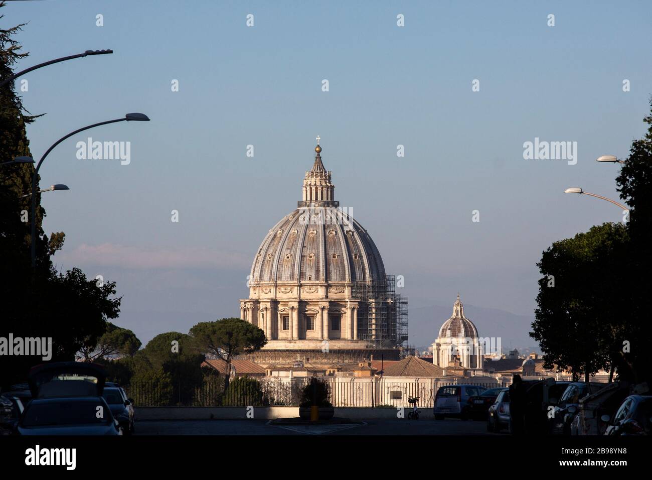 Roma, Italy. 23rd Mar, 2020. A view of the Saint Peter's dome from Via Niccolo Piccolomini in Rome during the 14th day of lockdown imposed nationwide by the Italian government that tries to tackle the coronavirus outbreak. Every movements in the citiies are restricted, and streets usually filled with life and traffic are almost empty (Photo by Giuseppe Fama/Pacific Press) Credit: Pacific Press Agency/Alamy Live News Stock Photo