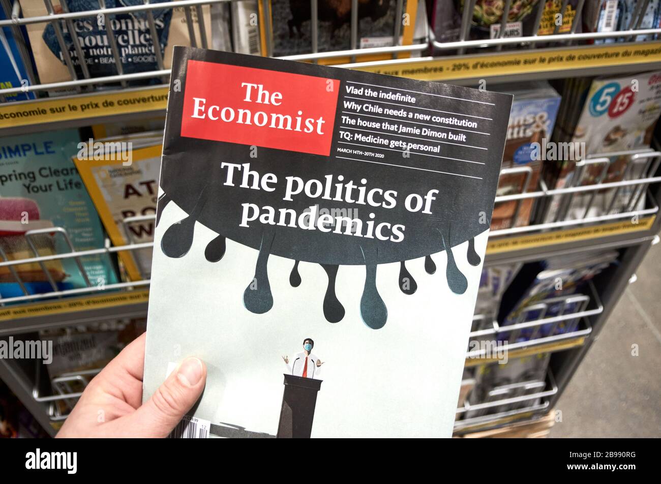 Montreal, Canada - March 23, 2020: The Economist magazine with The Politics of Pandemics title. The Economist is an English-language weekly magazine-f Stock Photo