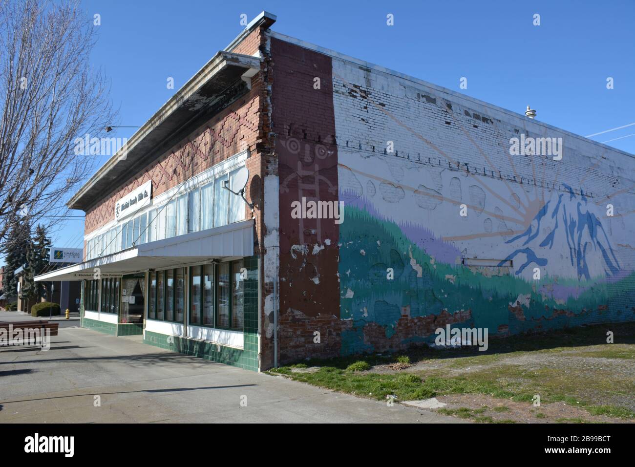 A mural showing Mt Adams painted on the side of a historic building
