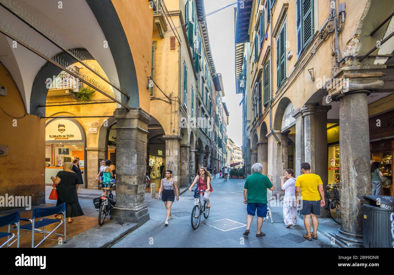 lined with cafes and shops, the arcaded Borgo Stretto a popular alleyway in the old parts of Pisa, Tuscany, Italy Stock Photo