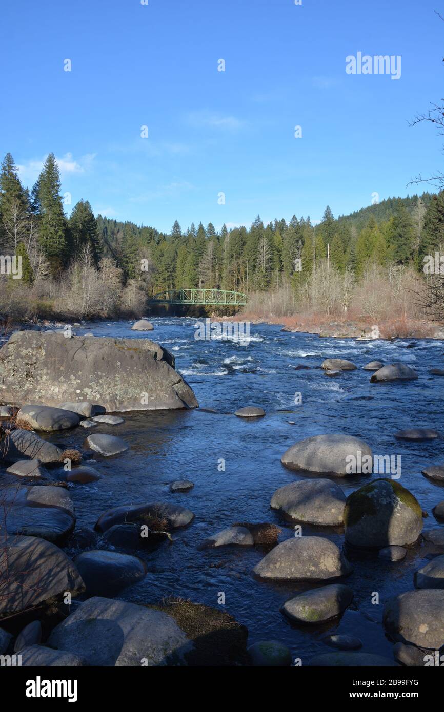 The Sandy River and Lusted Road Bridge, an iron truss bridge, at Dodge Park, Clackamas County, Oregon, USA. Stock Photo