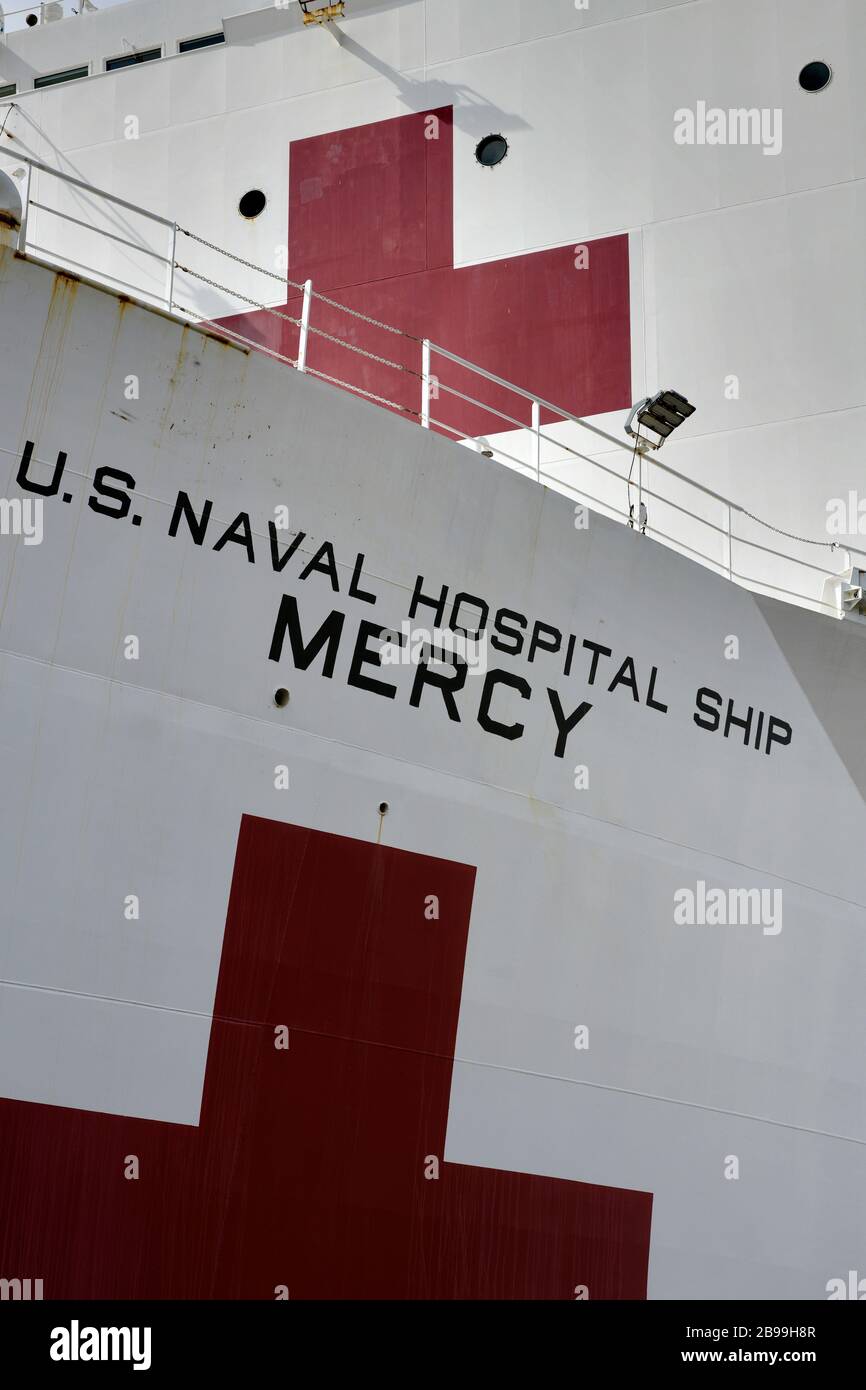 San Diego, California, USA. 23rd Mar, 2020. USNS Mercy is tied up pierside at Naval Base San Diego. Mercy, one of two Navy hospital ships, is being deployed to the Port of Los Angeles to provide overflow medical care with the goal of freeing up traditional hospital space for COVID-19 patients. Credit: David Barak/ZUMA Wire/Alamy Live News Stock Photo