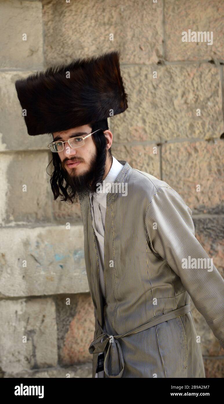 A Hasidic Jewish man wearing a Shtreimel ( traditional Fur hat ) in Mea Shearim neighborhood in Jerusalem. Stock Photo