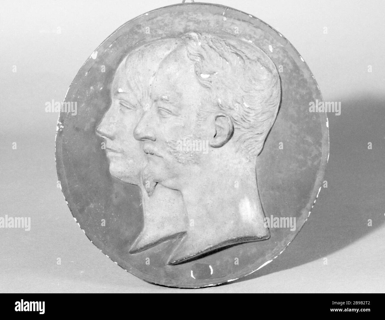 MEDALLION ROUND OF DIRECTOR AND OFFICER LOUIS-FELIX-ETIENNE, MARQUIS DE TURGOT (1796-1866) AND HIS WIFE Jean-Pierre Dantan (1800-1869) dit Dantan le Jeune. Médaillon rond de l'administrateur et officier, Louis-Félix-Etienne, marquis de Turgot (1796-1866) et de son épouse. Relief. Plâtre patiné, fond bleu, 1852. Paris, musée Carnavalet. Stock Photo