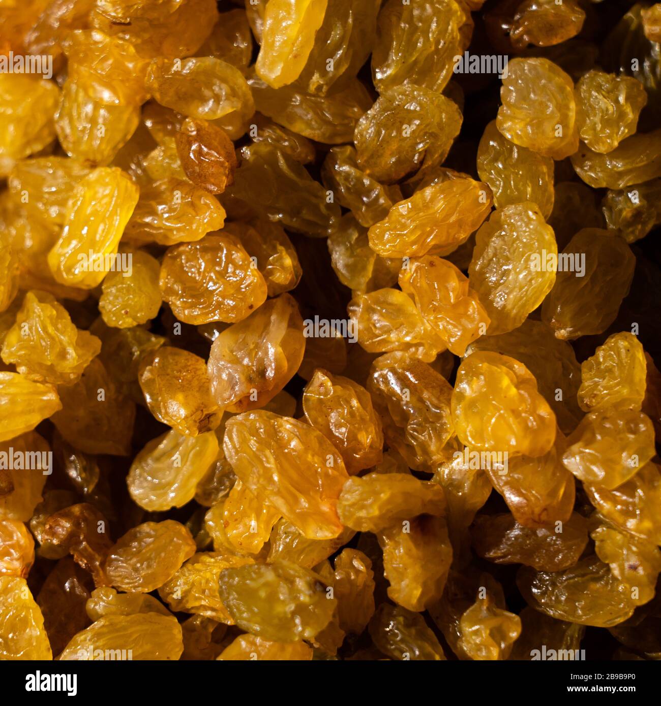 Raisins. Macro. Raisins as background Grape Raisin texture Stock Photo