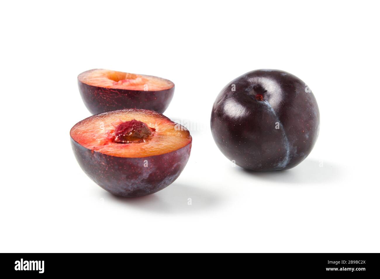 Black ripe plums isolated on white background Stock Photo