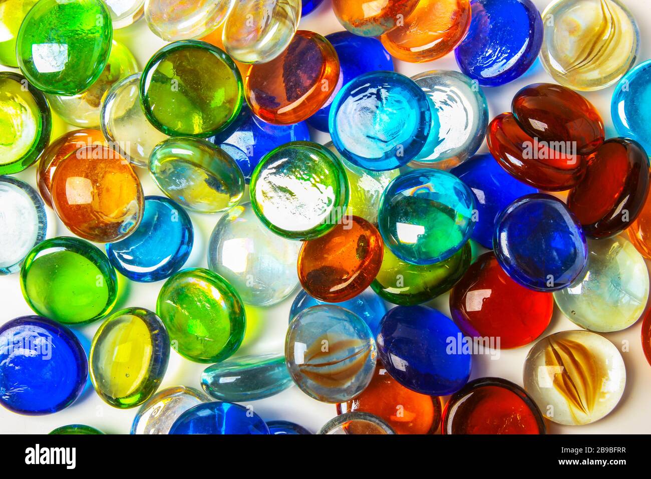 Background formed by a wall made of colored glass stones Stock Photo