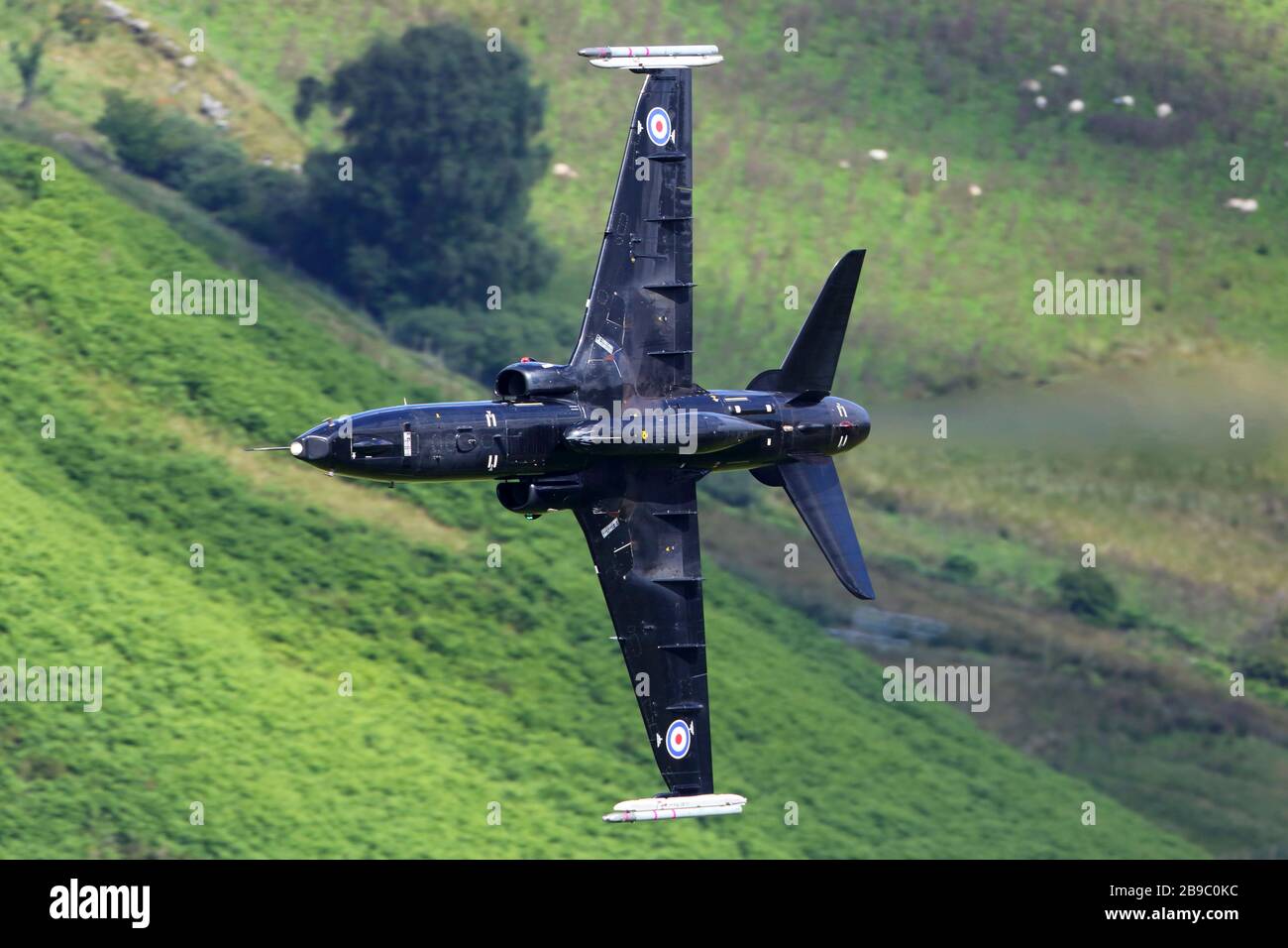 Hawk T2 training aircraft of Royal Air Force during training flight in Wales, United Kingdom. Stock Photo