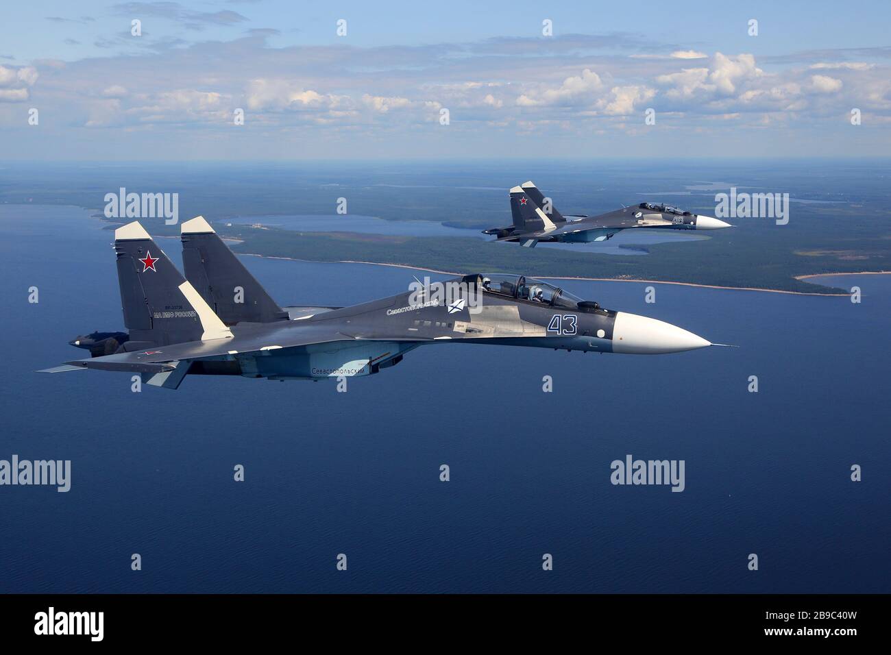 Su-30SM jet fighters of the Russian Navy flying over Gulf of Finland, Russia. Stock Photo