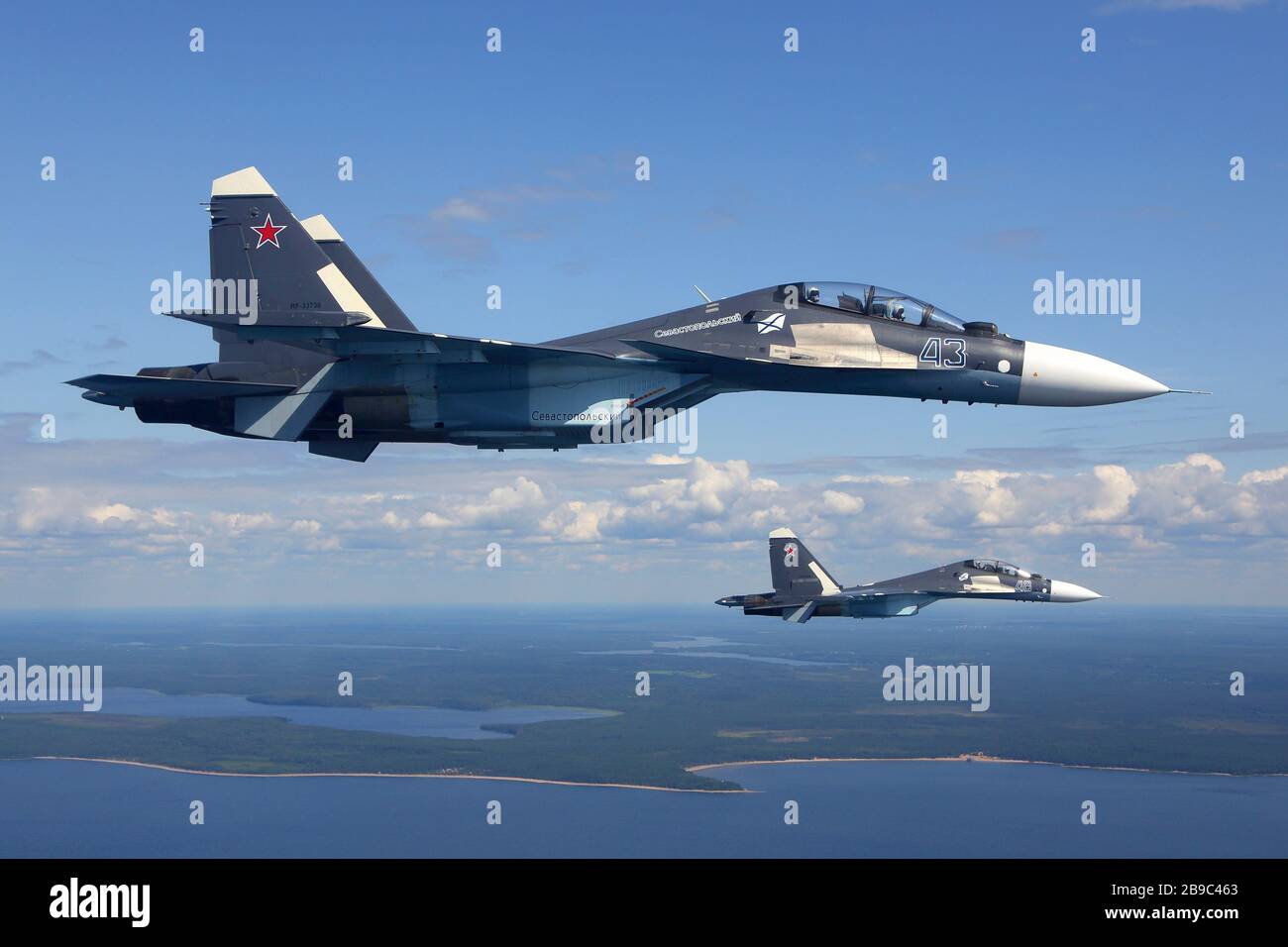 Su-30SM jet fighters of the Russian Navy flying over Gulf of Finland, Russia. Stock Photo