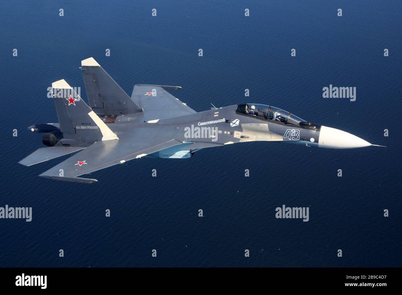 Su-30SM jet fighter of the Russian Navy flying over Gulf of Finland, Russia. Stock Photo
