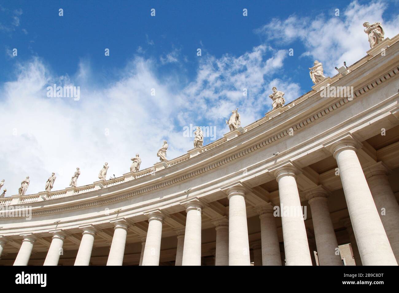 A group of Saint Statues on the colonnades of St Peter's Square with ...
