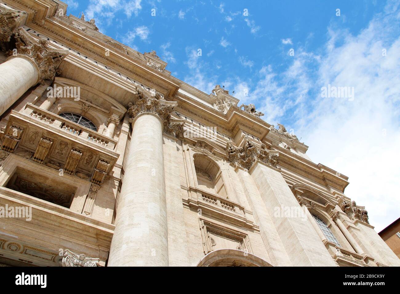 Facade decoration with big column and sculptures of St. Peter's ...