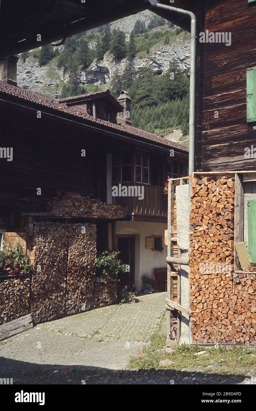 Stacked up wood for the winter in an alley in Splügen in Switzerland