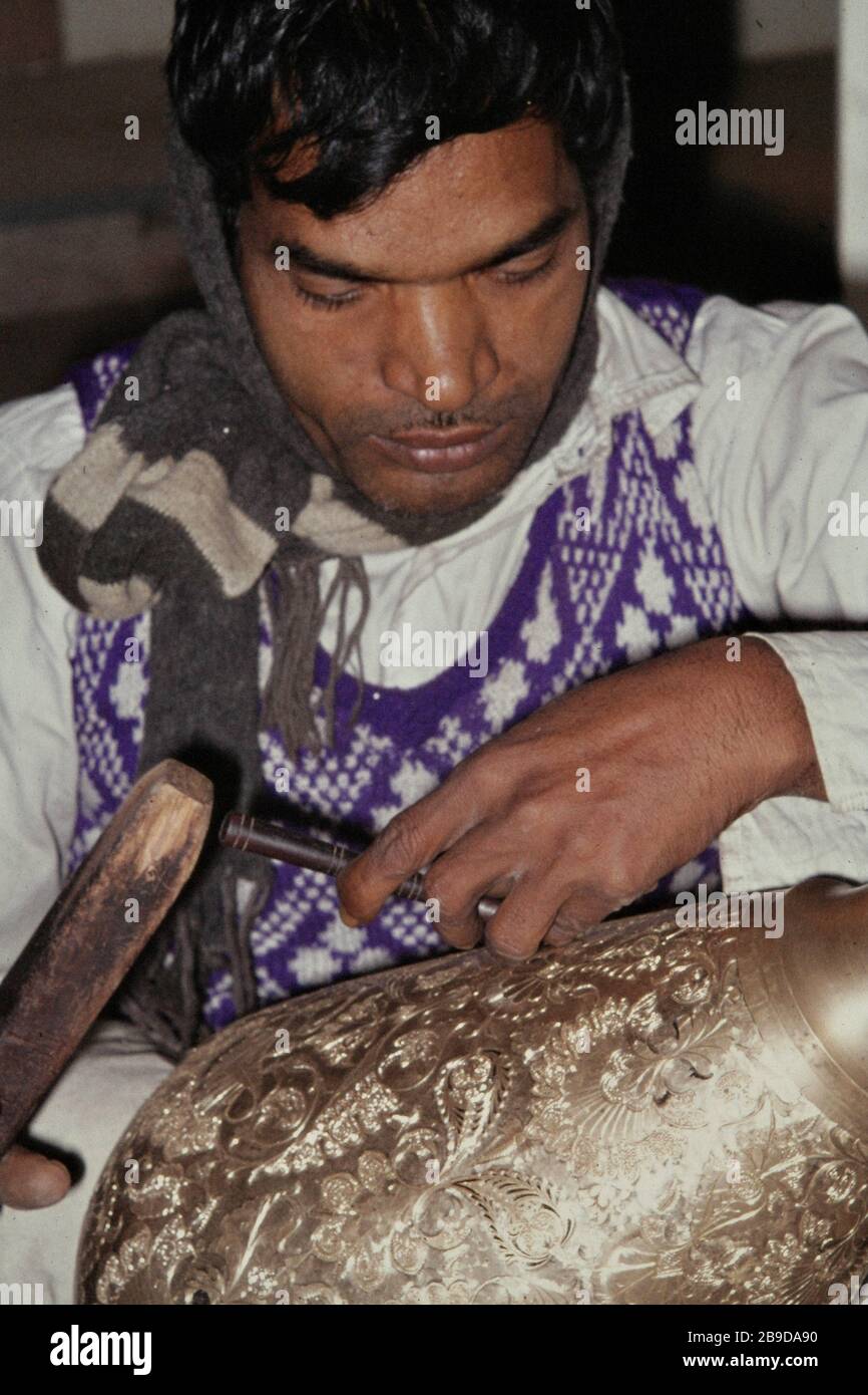 Brass chaser at work in Ivory Palace near the Qutub Minar in