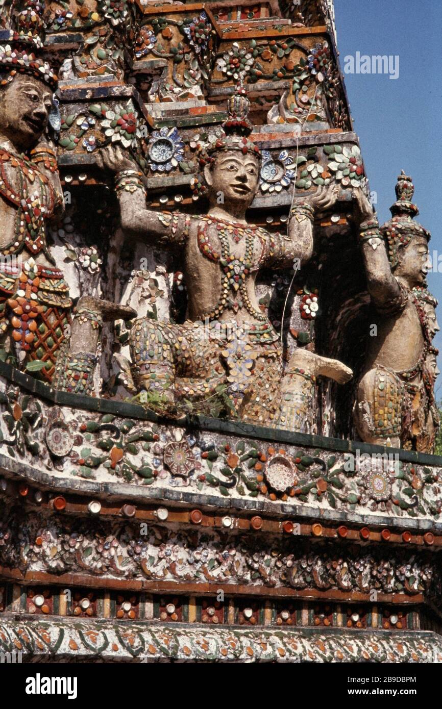 Ornate statues serve as supports for a temple in Bangkok. [automated