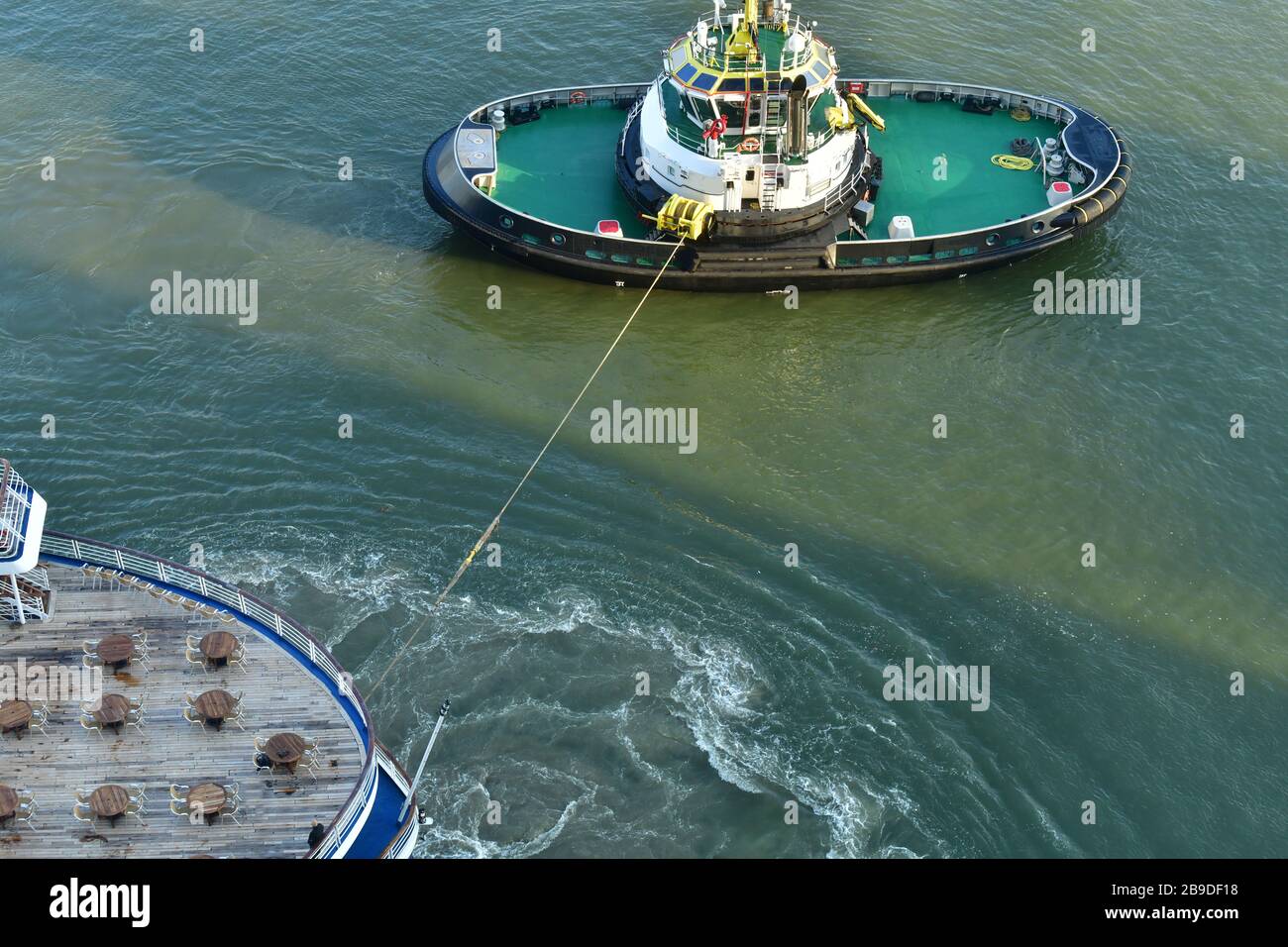 Helicopter view of stern of cruise ship with wooden deck towed away