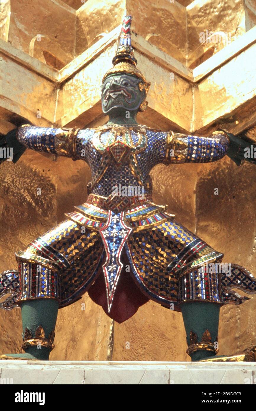 Carrying figure with mask and elaborate decorations at the temple of