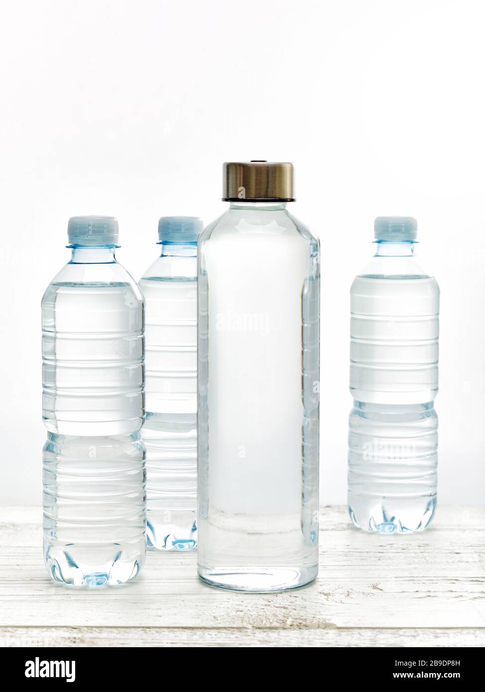 Concept of zero waste with refillablle glass water bottle versus single use plastic bottle Stock