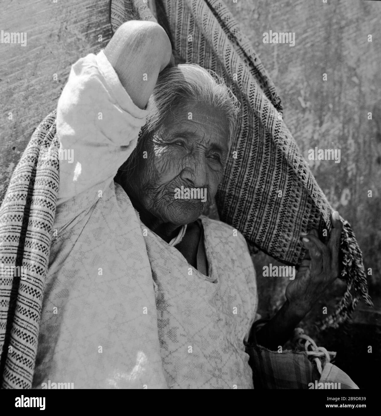 An Old Woman In Cuernavaca In Mexico Throws A Scarf Over Her Head [automated Translation] Stock