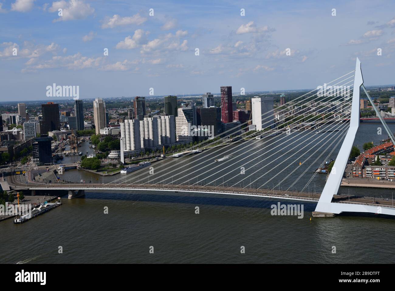 Overview of Rotterdam with in forefront the Erasmusbrug and Noordereiland, looking to city center over the Leuvehaven on an extremely clear day with T Stock Photo