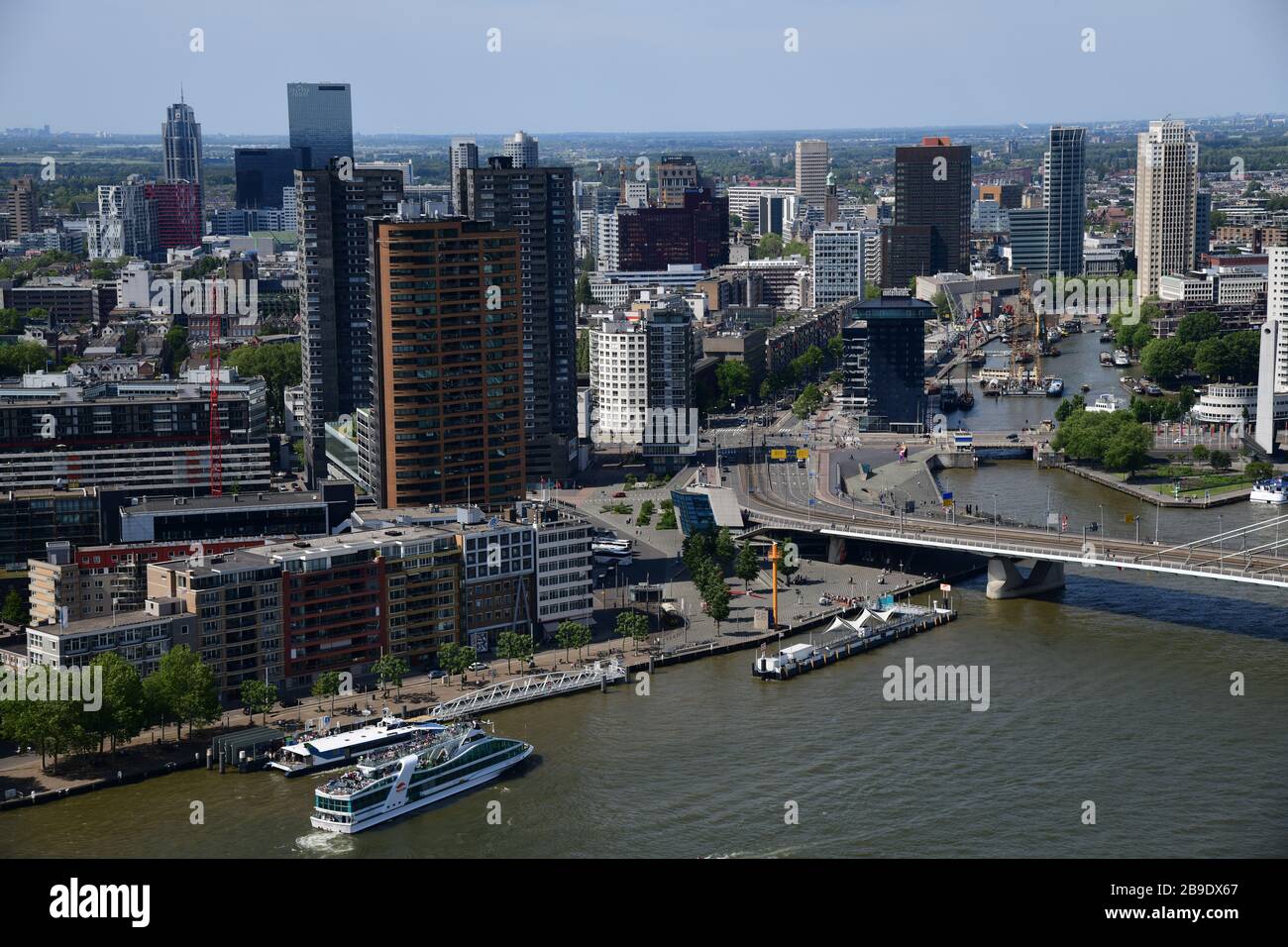 Overview of Rotterdam with in forefront the Erasmusbrug, looking to city center over the Leuvehaven on an extremely clear day with T Stock Photo