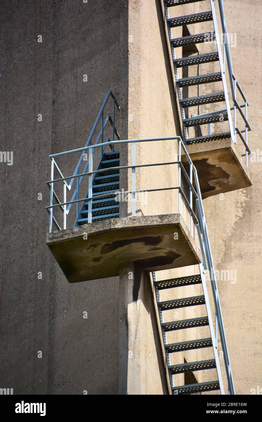 Close up of staircase on the outside of a sleek concrete former silo building on the Rijnhaven in Rotterdam providing an abstract look Stock Photo